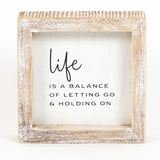 Life Is A Balance Box Sign.