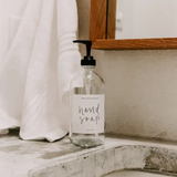 Glass Hand Soap Dispenser with White Label.